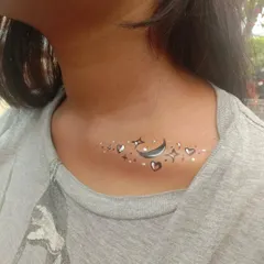 A celestial design on the collarbone, featuring a crescent moon, stars, and hearts. This is a whimsical and popular choice.