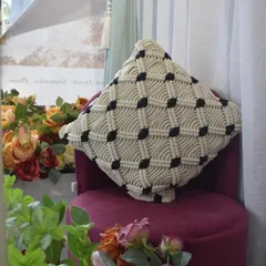 Another angle of the macramé cushion cover, showing how it beautifully catches the light. We can customize colors to match your interior design.