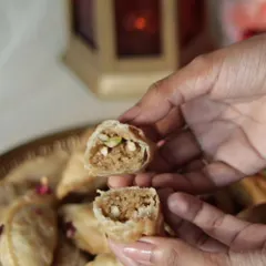 The heart of my Nutty Gujiya, showing the rich, homemade mawa and nut filling. This is my mom's recipe, a taste of my North Indian roots.