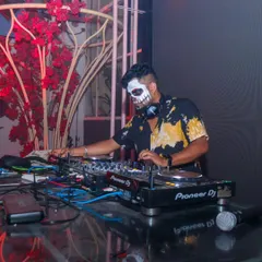 At the console during a Halloween 2.0 party, mixing spooky tracks and party anthems.