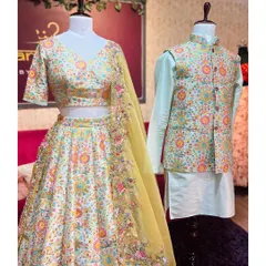 This coordinated couple set is perfect for sangeet or engagement ceremonies. It includes an off-white lehenga with vibrant multi-color floral embroidery, paired with a mint-green kurta and a matching embroidered Nehru jacket.