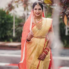This is a quintessential South Indian muhurtham look. I created a flawless base with a bold red lip for Supritha, which stands out beautifully against her golden silk saree and traditional jewellery. The detailed bridal braid completes this timeless look.
