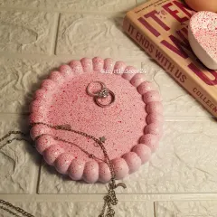 Our Pinterest-famous bubble tray in a soft pink with a red speckled finish. It’s a perfect decorative tray for holding rings, necklaces, or other small treasures on your dresser.