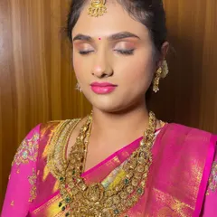 A close-up of this bride's makeup, presented without any filters. You can see the smooth skin texture and the clean blend of the eyeshadow.
