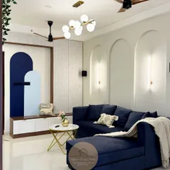 A beautiful living room at Candeur Signature, Bangalore. We used arches and a bold blue sofa to create a modern yet timeless space. The custom TV unit features a unique painted design, adding an artistic touch.