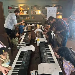 Another angle from our popular keyboard workshop at Soho House. You can see the mentors giving individual attention to help the kids learn their first notes.