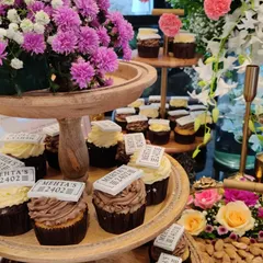 Personalized details make an event special. For a private housewarming, we created these custom cupcakes with edible toppers featuring the family's name and new address, adding a thoughtful touch to the celebration.