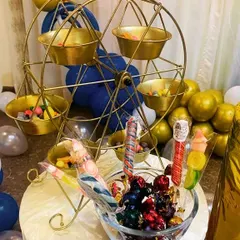 This miniature ferris wheel is one of our most popular props for dessert tables. We fill it with candies and sweets, adding a fun, interactive element that both kids and adults enjoy.