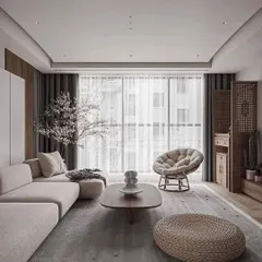 This wide view of a modern living room showcases the importance of natural light in our designs. The floor-to-ceiling windows, sheer curtains, and light color palette create a bright and airy space, perfect for relaxation.
