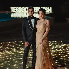 The happy couple, ready for their reception party. Tessa's glam makeup and elegant gown make for a stunning pair with her husband's classic tuxedo.