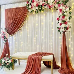 This is another look at our popular L-shaped arch design. Even without the extra stools, the setup remains full and elegant, creating a perfect, intimate spot for the guests of honor. We can customize the seating to fit your event’s needs.