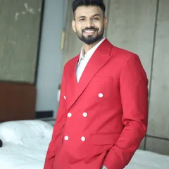 A vibrant red double-breasted blazer makes an undeniable impact. We designed this for a client's special event, ensuring he would stand out with confidence and style.