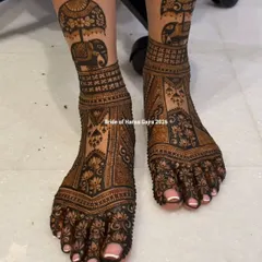 A bride's look is complete only when her feet are adorned with beautiful henna. I designed this piece with royal elephants and intricate lotus panels to create a grand, traditional statement for her special day.