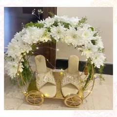 A chariot of elegance for the bride's footwear. We used this beautiful floral carriage display to present a pair of embellished sandals as part of a luxury trousseau.