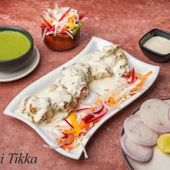 For those who prefer a milder flavour, our Malai Tikka is perfect. The chicken is marinated in a creamy mixture of cream, cheese, and gentle spices, making it incredibly tender and rich.