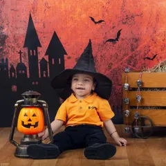 Our little warlock is ready for some trick-or-treating with his pumpkin lantern. My Halloween setups are more cute than spooky!