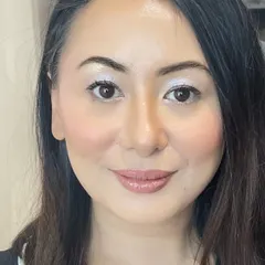 A close-up of the finished airbrush makeup look. The result is a flawless yet natural finish that enhances her features, perfect for clients who want a lightweight feel.