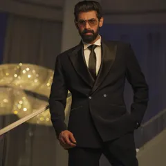 For Rana Daggubati at the IIFA Awards, I aimed for a look of pure, classic Hollywood glamour. This shot captures the sharp lines of his custom Raamz Label tuxedo against the architectural details of the venue.