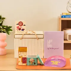 My "Zen Gift Box" is designed for relaxation and mindfulness. It contains a "Let It Go" de-stress journal, calming perfume, and other items to help someone unwind.