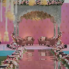 This breathtaking mirror mandap was a vision of modern royalty. The intricate silver work and cascading fountains created a shimmering sanctuary for the couple to exchange their vows, blending tradition with pure fantasy.