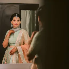 Another angle of the bride at her vanity. This quiet moment of reflection before the event begins is a testament to the transformative power of makeup in helping a bride feel her absolute best.