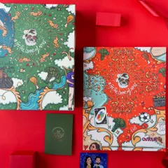 Two versions of the custom doodle art boxes, one in red and one in green, showing how I can adapt a design to create variety for a large event.