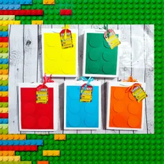 The handmade paper bags are designed to look like giant building blocks and come in various bright colors.