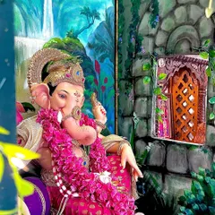 A close-up view of the details. The hand-painted stone window on the side wall and the lush greenery in the backdrop are designed to create a complete, three-dimensional scene for the Ganpati murti.