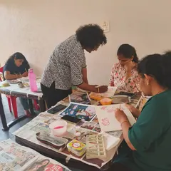One of our instructors providing individual guidance during a Pichwai painting session. We offer hands on support to every student, ensuring they feel confident as they learn.