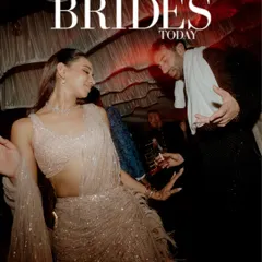 The energy of the dance floor, featured in Brides Today. This candid shot captures the couple lost in the rhythm of their celebration, showcasing the fun and dynamic atmosphere of their wedding night.