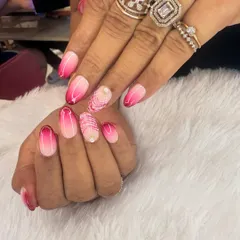 A vibrant pink ombre design that fades from a soft baby pink to a deep magenta. An accent nail with delicate white line work adds an artistic touch.
