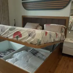 We believe bedrooms should be sanctuaries of calm and clever storage. This modular bed features a veneer finish and a powerful gas-pump lift-up mechanism, revealing a huge, easily accessible storage space for linens and more.
