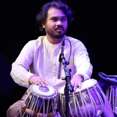 A moment of intense concentration during a trio concert at NCPA Mumbai. Accompanying both sitar and sarod requires careful listening to support two distinct melodic voices.