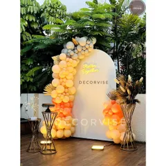For a trendy rooftop engagement party, I created this modern setup. It features a clean white arched backdrop, a custom "Better Together" neon sign, and an organic balloon garland in a warm, peachy color palette, accented with dried pampas grass for texture.