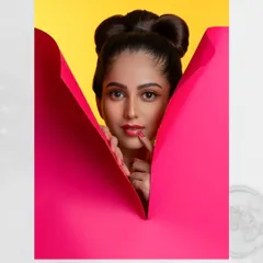 A different perspective from our pop-art inspired shoot. The way the pink paper creates a V-shape naturally draws the eye to the model's face. This kind of thoughtful composition helps create dynamic and engaging actor headshots and model lookbooks.