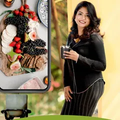 My practice is a blend of the art of nourishing food and the science of functional nutrition. I am holding a cup, symbolizing the comforting, daily habits we build, while the phone shows the vibrant, healthy food that makes it all possible.