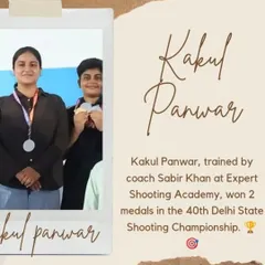 Kakul Panwar proudly displays her two medals won at the 40th Delhi State Shooting Championship. Her hard work in training is clearly paying off.
