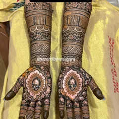 I believe bridal mehendi should feel like jewelry. This design features perfectly symmetrical patterns on both hands, with a central lotus motif and intricate bands that adorn the arms like timeless bracelets.