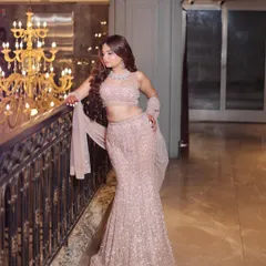 This rose-gold mermaid lehenga is designed to flatter your curves while bringing all the sparkle. It’s a modern take on bridal wear, perfect for a glamorous sangeet or engagement party.