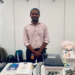Another member of our technical team at our booth, standing by the equipment we use for our installations. We are always prepared to answer detailed questions about our products, like the Plug N Smart chargers shown here.