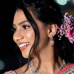 This close-up shows off that beautiful 'lit-from-within' glow. The skin looks healthy and radiant, and the makeup is soft and blended seamlessly for a flawless finish.