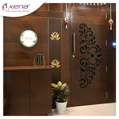 A beautiful wooden entrance door with a laser-cut floral pattern. We complemented it with a matching shoe cabinet and a backlit nameplate for a complete and welcoming look.