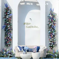 For a daytime event, I wanted to create a photo backdrop that was both fresh and breathtaking. This wall of flowers, with vertical columns of blue, purple, and white blooms, became a living piece of art for guests to enjoy.
