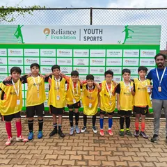 Our young team posing for a photo at the Reliance Foundation Youth Sports event. We provide opportunities for players to compete in prestigious national leagues.