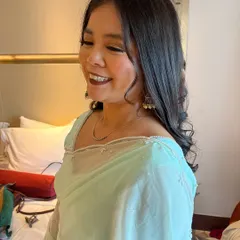 A candid shot showing her beautiful smile and the soft, glamorous makeup look.