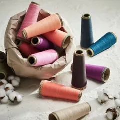 A vibrant product shot of threads and yarns. This simple, clean composition celebrates the colors and textures that are the starting point for beautiful home fashion textiles.