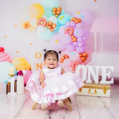 Another adorable shot from the candy-themed first birthday, showing a different angle of the colorful balloon and dessert props.