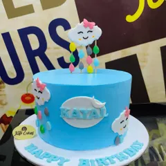 A simple and sweet 1.5kg cake with a cute, smiling cloud topper raining colorful drops.