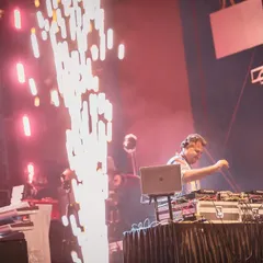 In the zone, mixing live with pyrotechnics firing up the stage. This shot captures the intensity and focus I bring to every performance, ensuring a seamless and powerful audio experience for massive concert audiences.