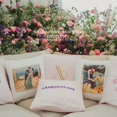 Customized pillows with the couple's photos, monogram, and wedding hashtag. These little surprises create a cozy and personalized lounge area for guests.